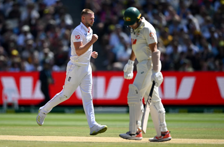 Scott Boland came out to open the batting with Travis Head Scott Boland came out to open the batting with Travis Head